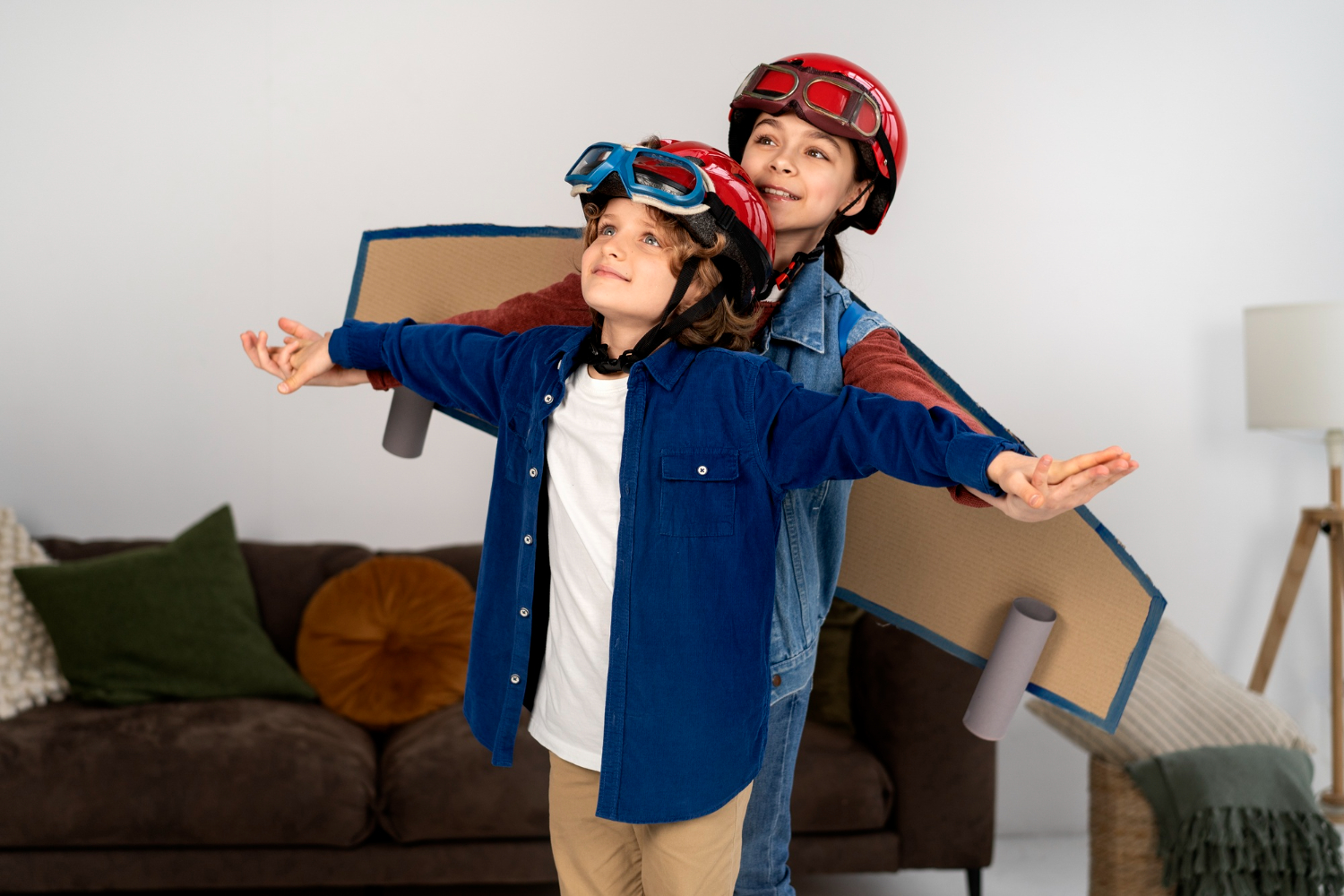 Siblings playing with flying goggles