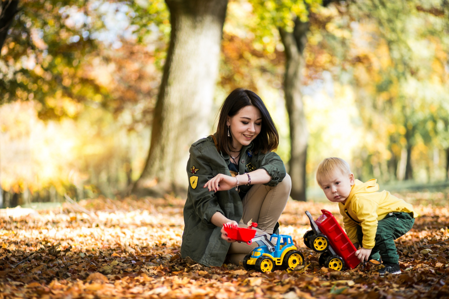 Mother and son together in an autumn park